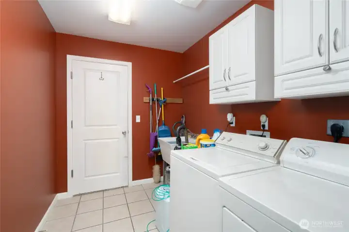 Laundry room with access to garage. Laundry room with access to garage.
