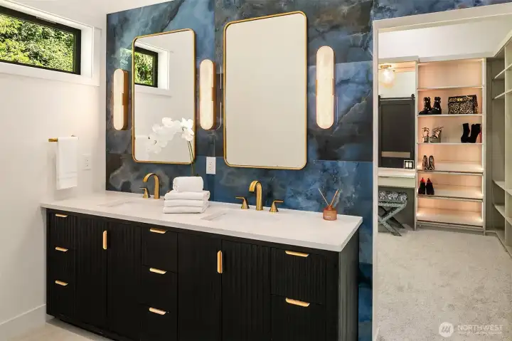 all new primary bathroom leads to walk in custom closet
