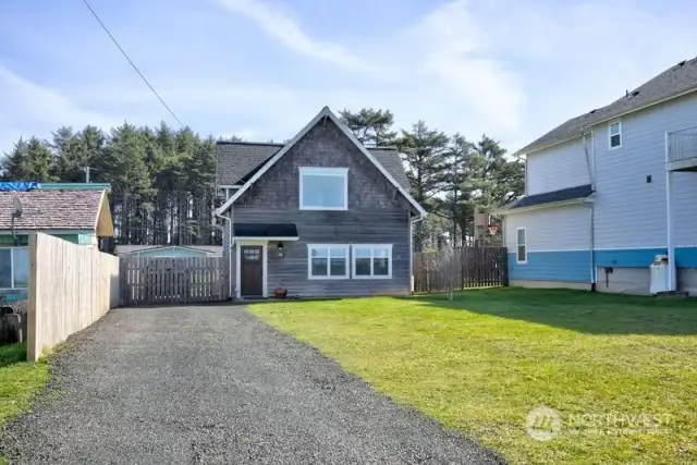 This cottage sits back off the street with plenty of room to build a main home, if desired. The cottage was built in 2008 and is updated and darling!