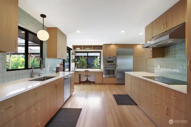 The remodeled kitchen features Thermador appliances and is designed for maximum utility