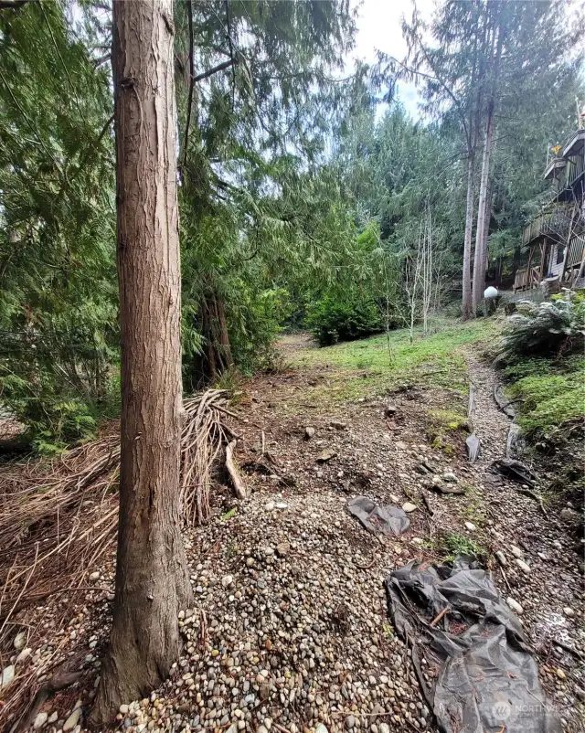 From very back of property and showing property line with neighbor.