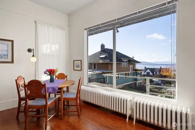 There is a large window that takes in the bay views from the formal dining area.