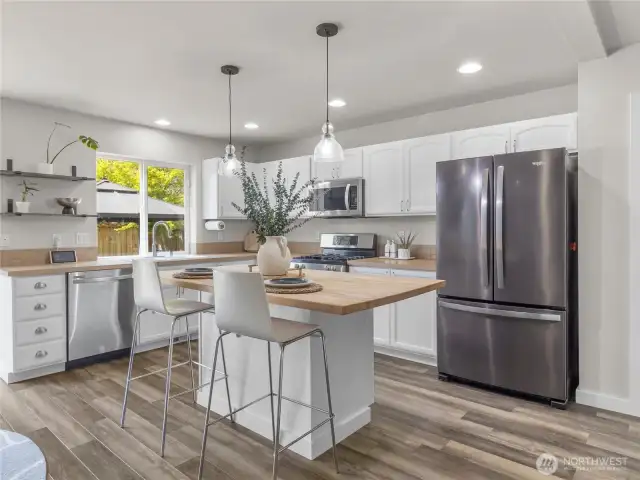 Kitchen with SS appliances.