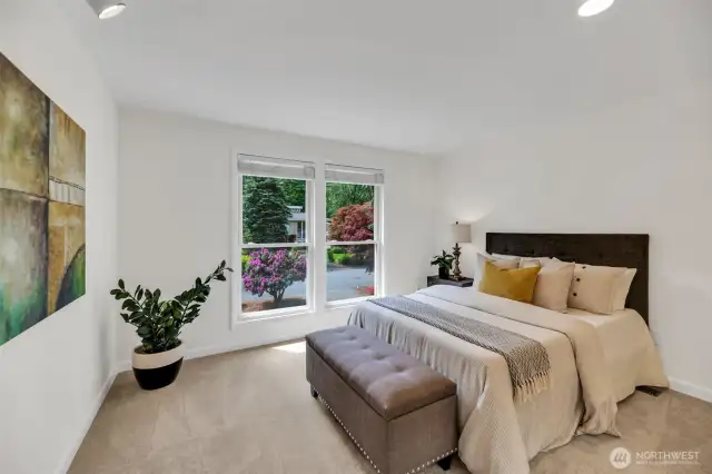 Light filled western facing second bedroom on upper level looks out over the gorgeous front yard