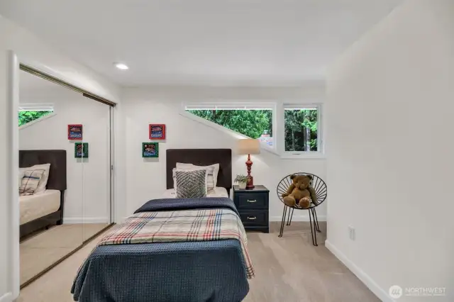 Third bedroom on upper level offers extreme privacy yet plenty of light