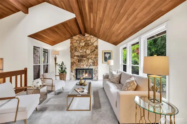 Statement floor to ceiling cozy wood burning fireplace is the ideal holiday gathering spot