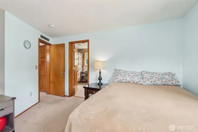 Generously sized primary suite w/ direct access to the en suite bath—your private retreat for rest & relaxation.