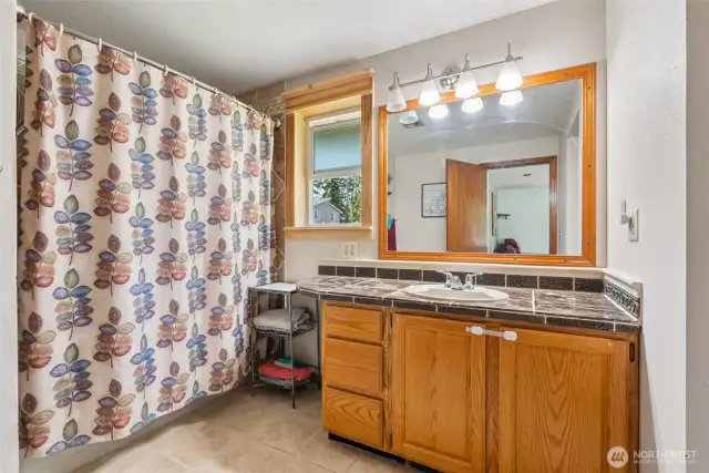rimary en suite bath offers a private, functional space w/ clean lines & everyday comfort.