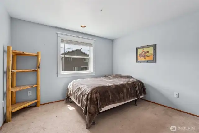 Comfortable bedroom w/ natural light & flexible space to suit your lifestyle—ideal for guests, work, or relaxation.