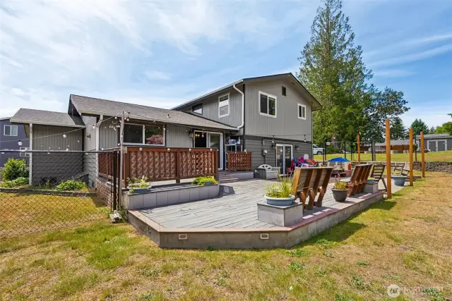 Expansive multi-level back deck built for entertaining—ideal for gatherings, outdoor dining & soaking in the surroundings.