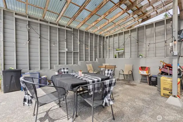 Dedicated covered parking area doubles as a spacious outdoor entertaining zone—protected, versatile & ready for year-round use.