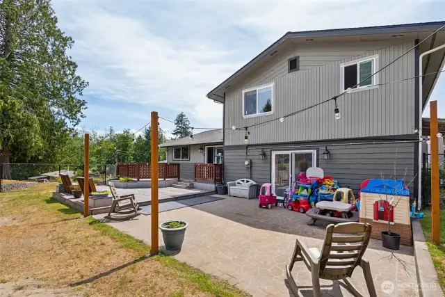 Fully fenced patio area w/ multiple deck levels—perfect for privacy, entertaining, & enjoying outdoor living from every angle.