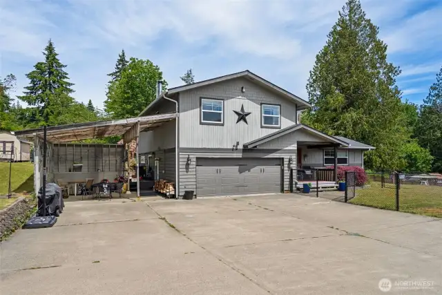 Set on a private road, featuring a spacious driveway, inviting entry & beautifully maintained exterior that welcomes you in.