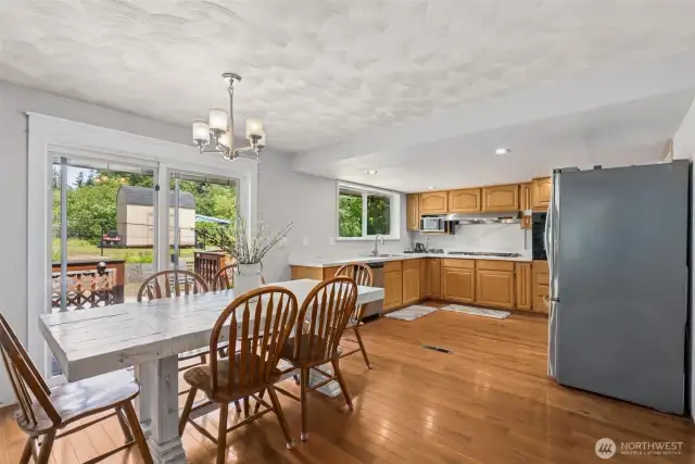 Dining area offers a warm connection to the kitchen—perfect for casual meals or hosting guests with ease.vvv