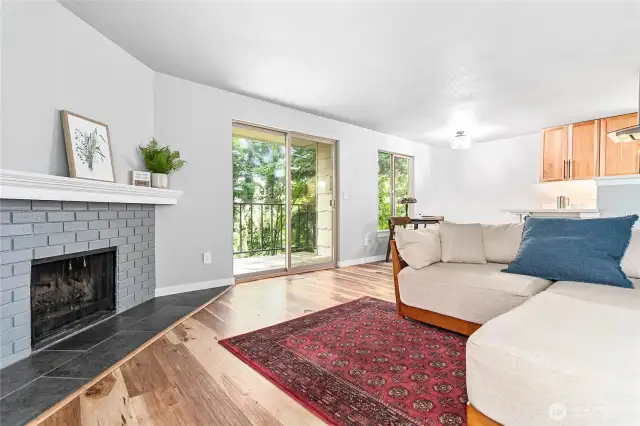 Cozy wood burning fireplace and nice natural light.