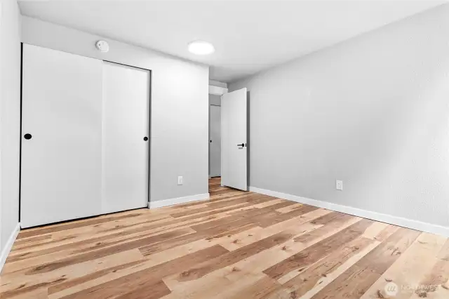 Bedroom 2 with beautiful flooring throughout!
