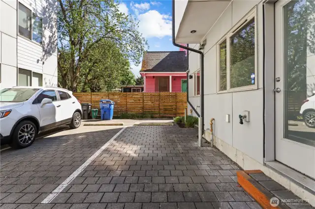 One designated off-street parking space out the kitchen door.  Plenty of street parking as well.