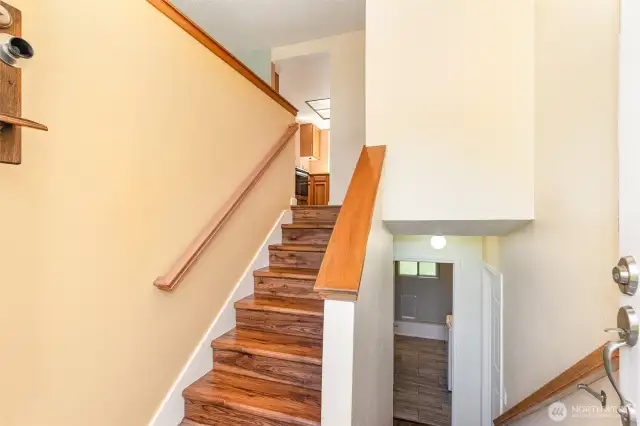 Enters to split entry, with main living space upstairs.