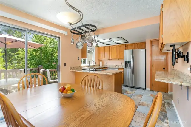 Dining room is conveniently located just off the kitchen, sliding door leads to the deck.