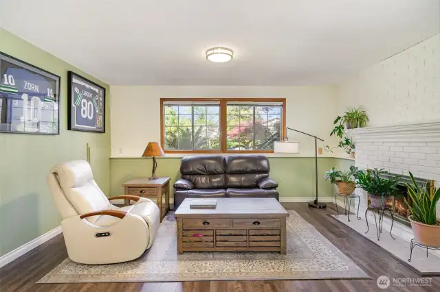 Another view of this versatile space featuring another cozy fireplace.
