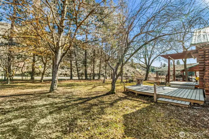 Outdoor Living Space -  Multiple deck areas provide inviting spaces to gather, unwind, and enjoy peaceful surroundings.