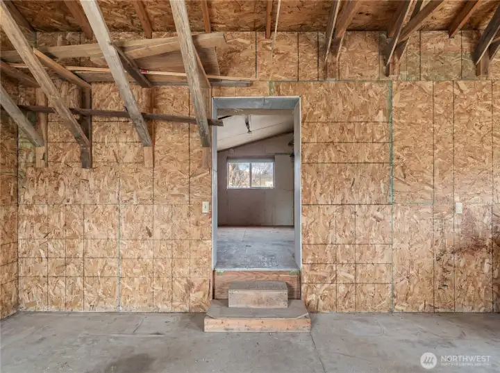 Detached Shop – Interior  Spacious shop interior shown empty to highlight the full usable space—ideal for projects, equipment storage, or creative workspace.