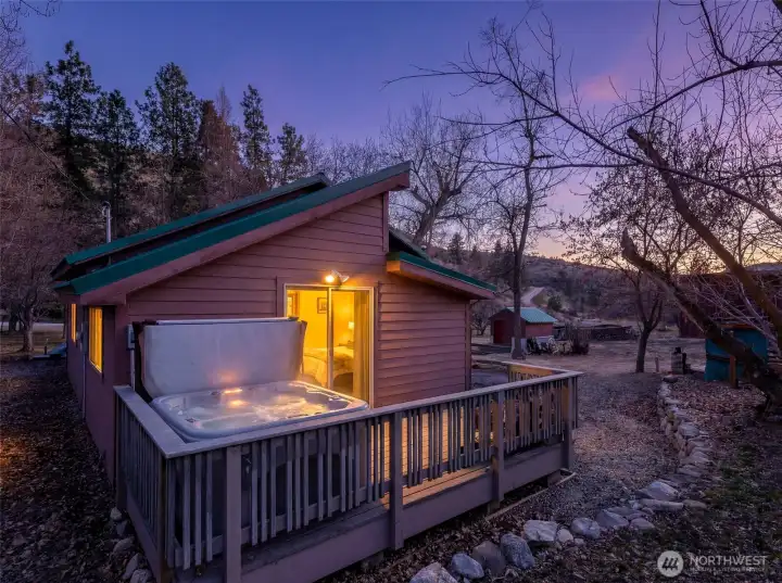 Hot Tub at Dusk -  Soak beneath colorful Chelan sunsets in your private hot tub retreat just off the primary suite.