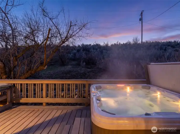 Hot Tub at Dusk -  Soak beneath colorful Chelan sunsets in your private hot tub retreat just off the primary suite.