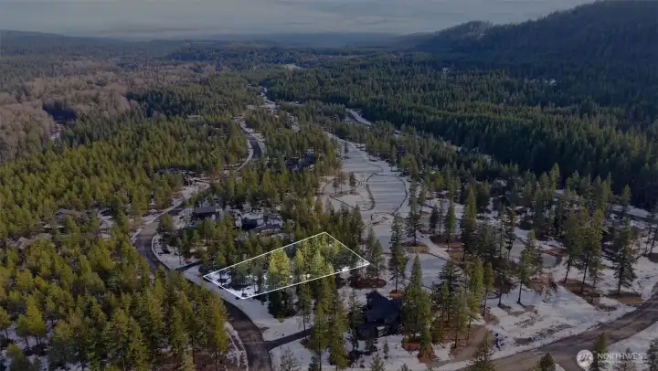 A flat, 1/2 acre property with a large building envelope. All utilities are available in the street.