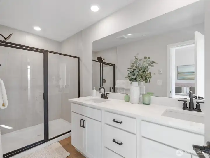 Luxurious walk in shower in primary bathroom.