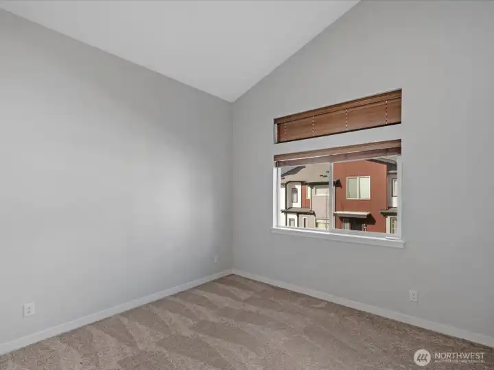 2nd upstairs bedroom with vaulted ceilings.