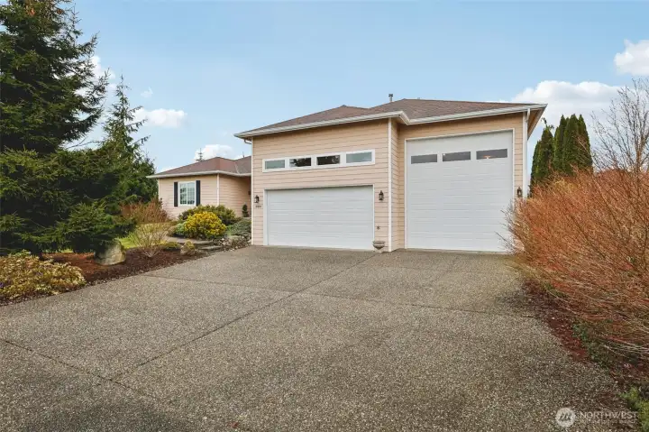 Oversized driveway, 3-car garage including RV bay, offering exceptional parking and storage