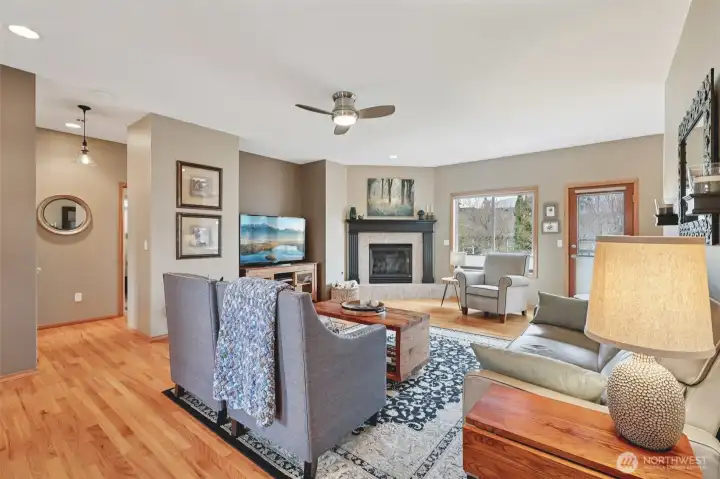 Bright entry opening into the main living area with hardwood floors