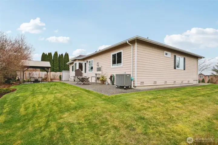View of the backyard and rear exterior of the home.