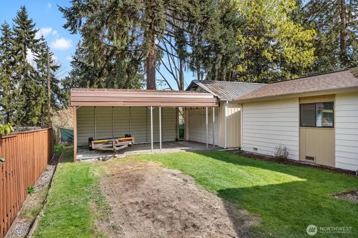 So much parking, double carport outside of the garage/shop.
