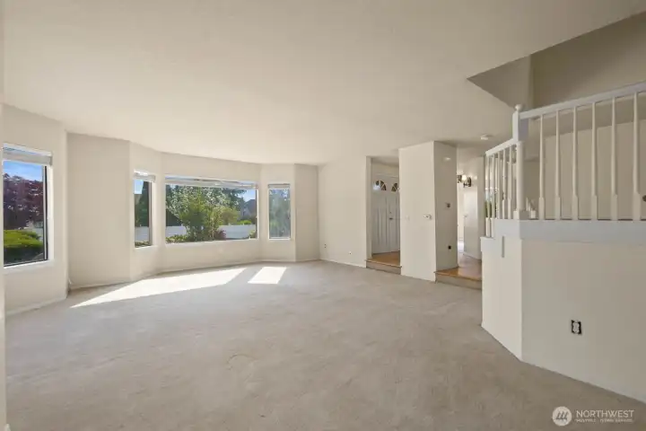 Living area viewed from the entry with a step-down layout and open sightlines into the main space