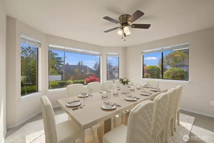 Virtually staged to define the dining space and show how it comfortably accommodates a full table for gatherings and everyday meals.