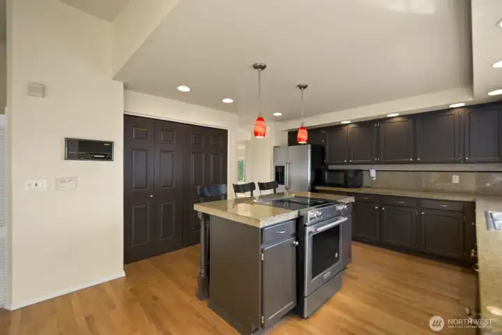 Kitchen with dual-basin sink set under a window, offering natural light over the main workspace