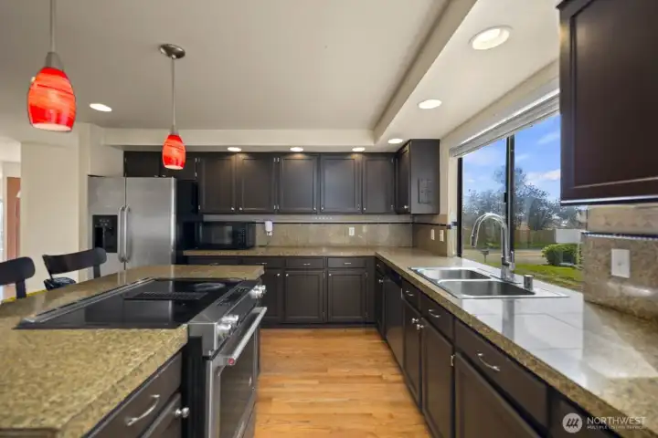 View from kitchen toward adjacent living area, showing open connection between spaces
