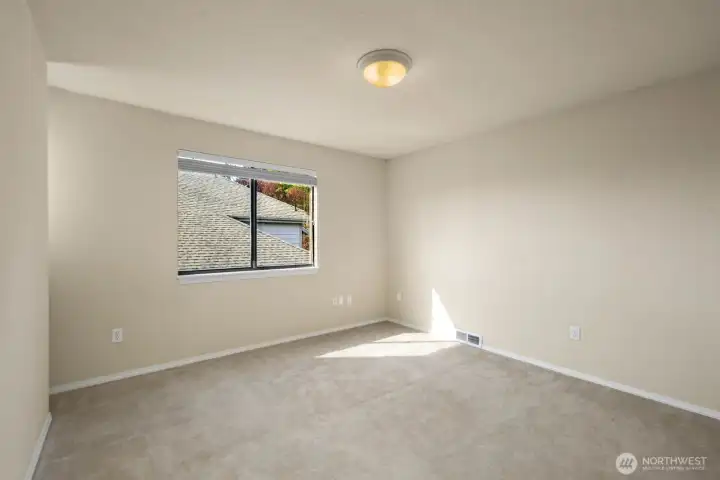 Additional bedroom with natural light and functional layout.