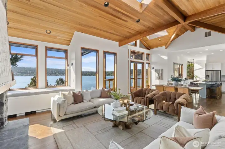 Walls of glass frame breathtaking lake views! Notice the hardwood flooring that complements the Great Room.