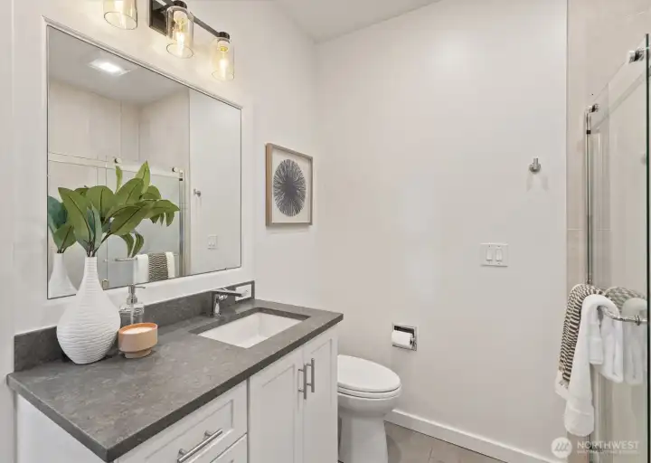 A well-appointed 3/4 bath on the lower level to support the two bedrooms.