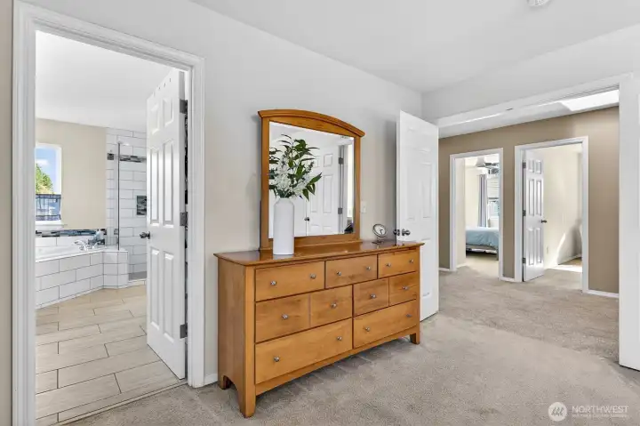 Primary BR, Bathroom & french doors that open to upper hallway and 3 more bedrooms.