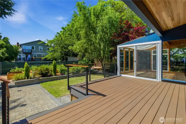 Spacious rear deck off of sunroom.