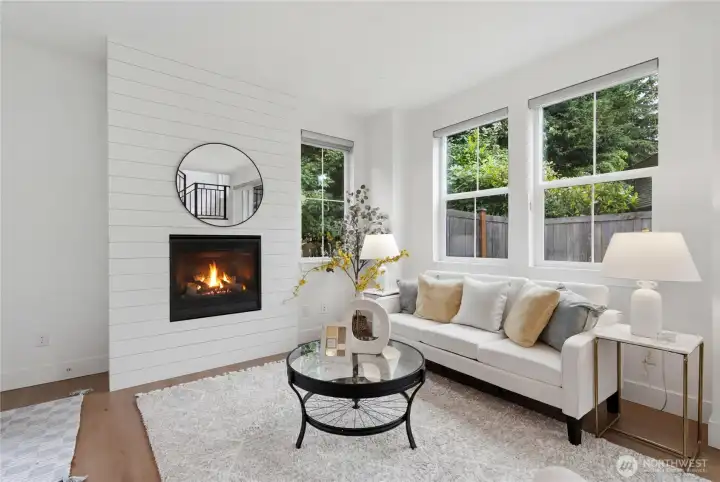 Gas fireplace with shiplap surround.
