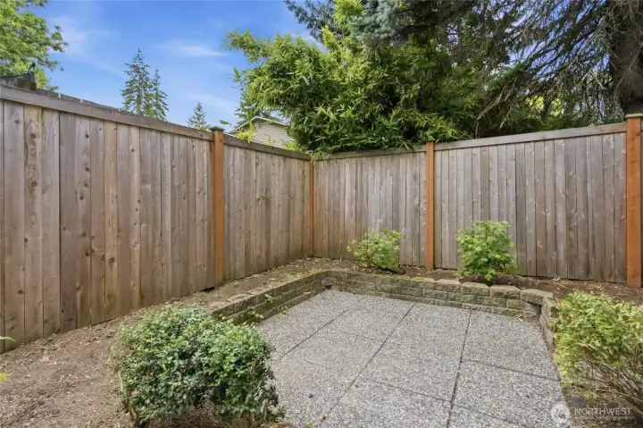 Fully fenced low maintenance backyard.