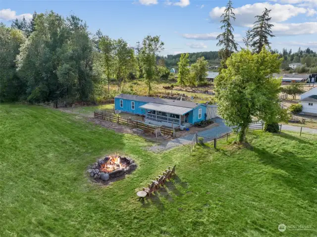 The ADU is a 1994 2 bedroom, 2 bathroom, 924 square foot manufactured home. If you keep walking and follow the path past the firepit and towards the woods, you can walk quite a ways and view the rest of the property.