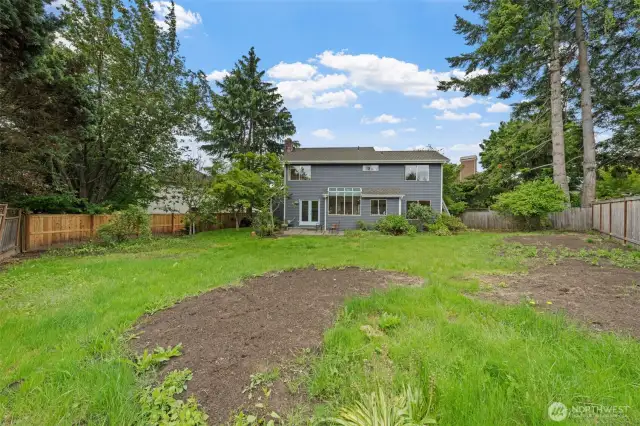 Large backyard waiting for your vision!