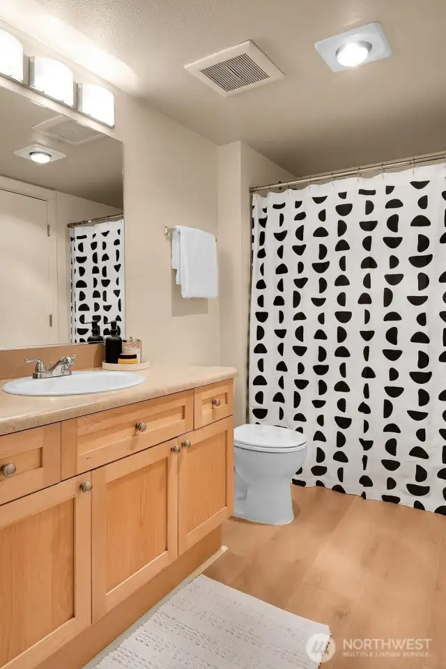 Full continental bath accessible from both the hallway & bedroom.