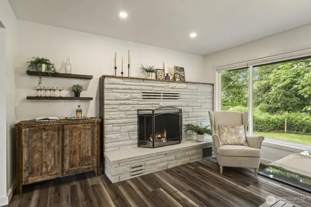 Bright and spacious dining room with built-in bar and large windows creating an inviting atmosphere.